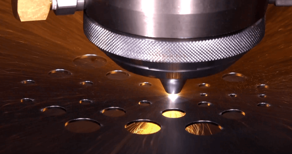 Regius-AJ Laser cutter close up of holes in sheet