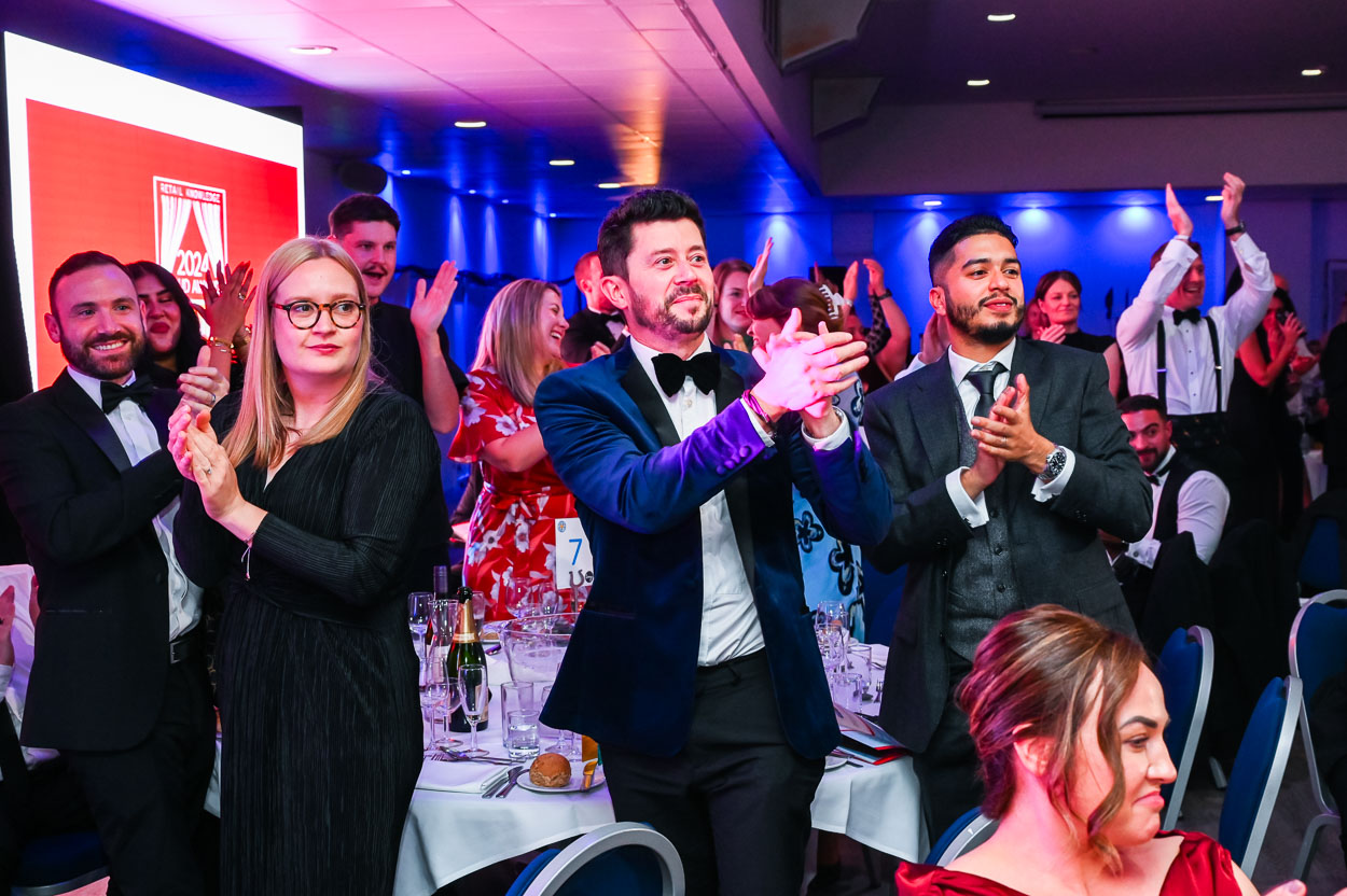 Photograph of Crowd standing to applaud at Dinner Event