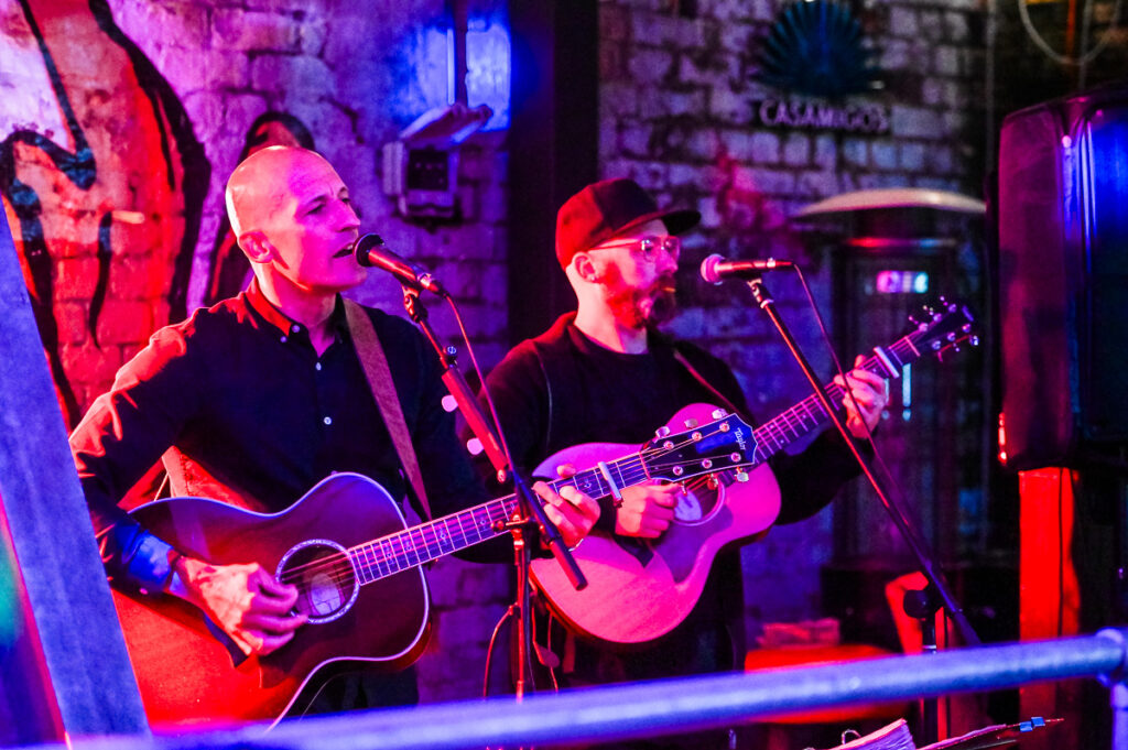Guitarists playing in a band